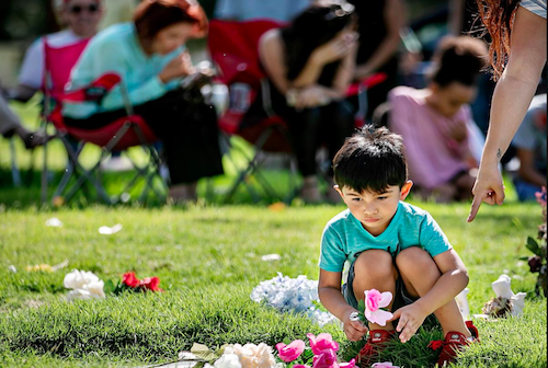 "Jonah Martinez, 4, places flowers on a grave marker Saturday during a service sponsored by Abortion Free New Mexico at Sandia Memory Gardens in Albuquerque. A crowd of some 50 abortion opponents turned out to pray at the cemetery in one of over 180 similar services being conducted across the country."

Jim Weber/The New Mexican